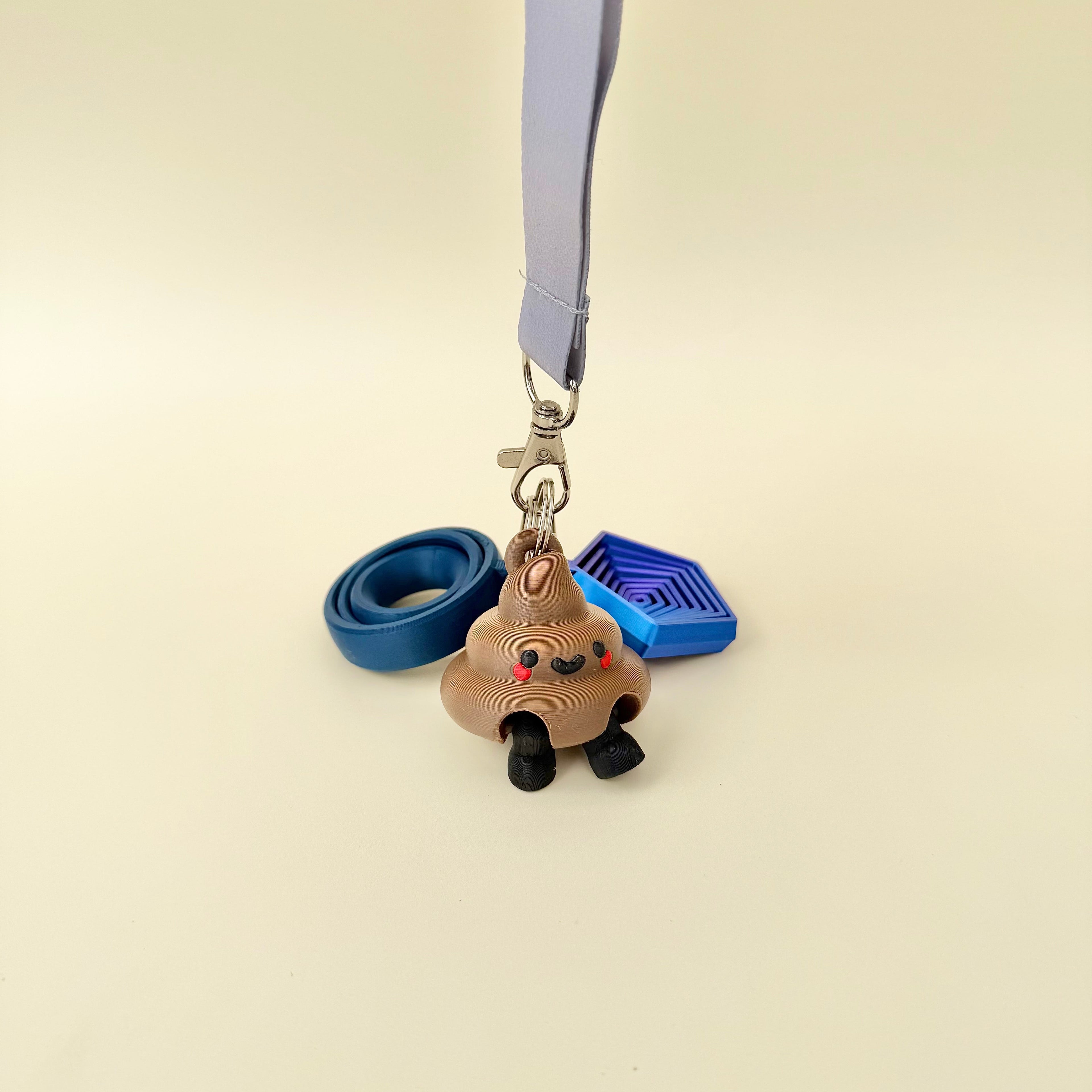 Small novelty poop keyring with moving legs and a sweet face, great for gifting and adding personality to bags.

