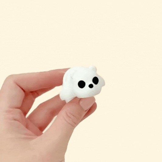 Pocket-sized polar bear fidget toy with flexible legs and head, ideal for sensory play and relaxation.