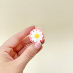 Flower-shaped sensory toy with textured petals and built-in loop for keyring use.