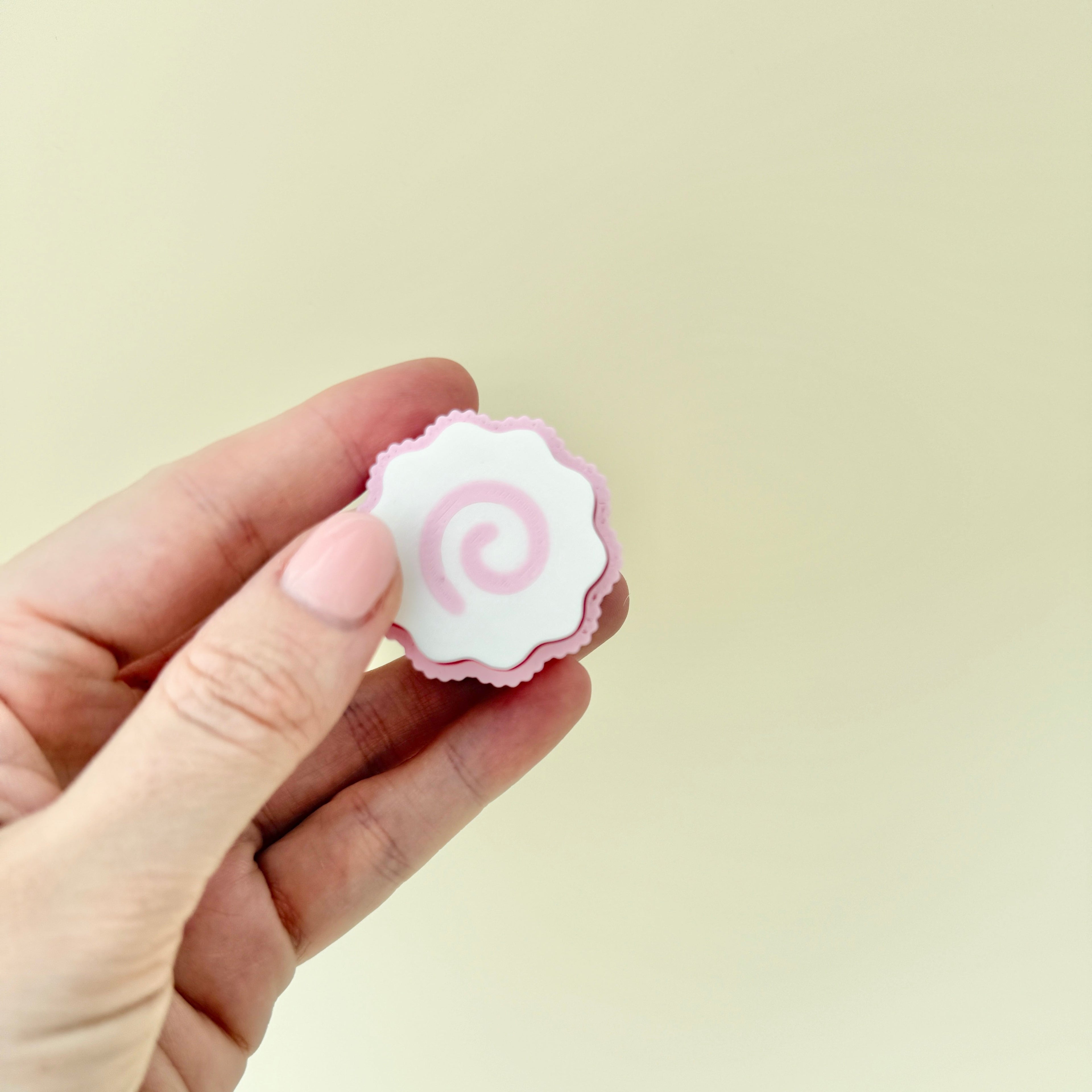 Portable sensory clicker inspired by narutomaki design.