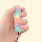 A compact fidget roller with a wrist strap for easy attachment to bags or keys.