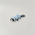Compact 10cm raccoon fidget toy with lifelike colouring, ideal for stress relief and play.