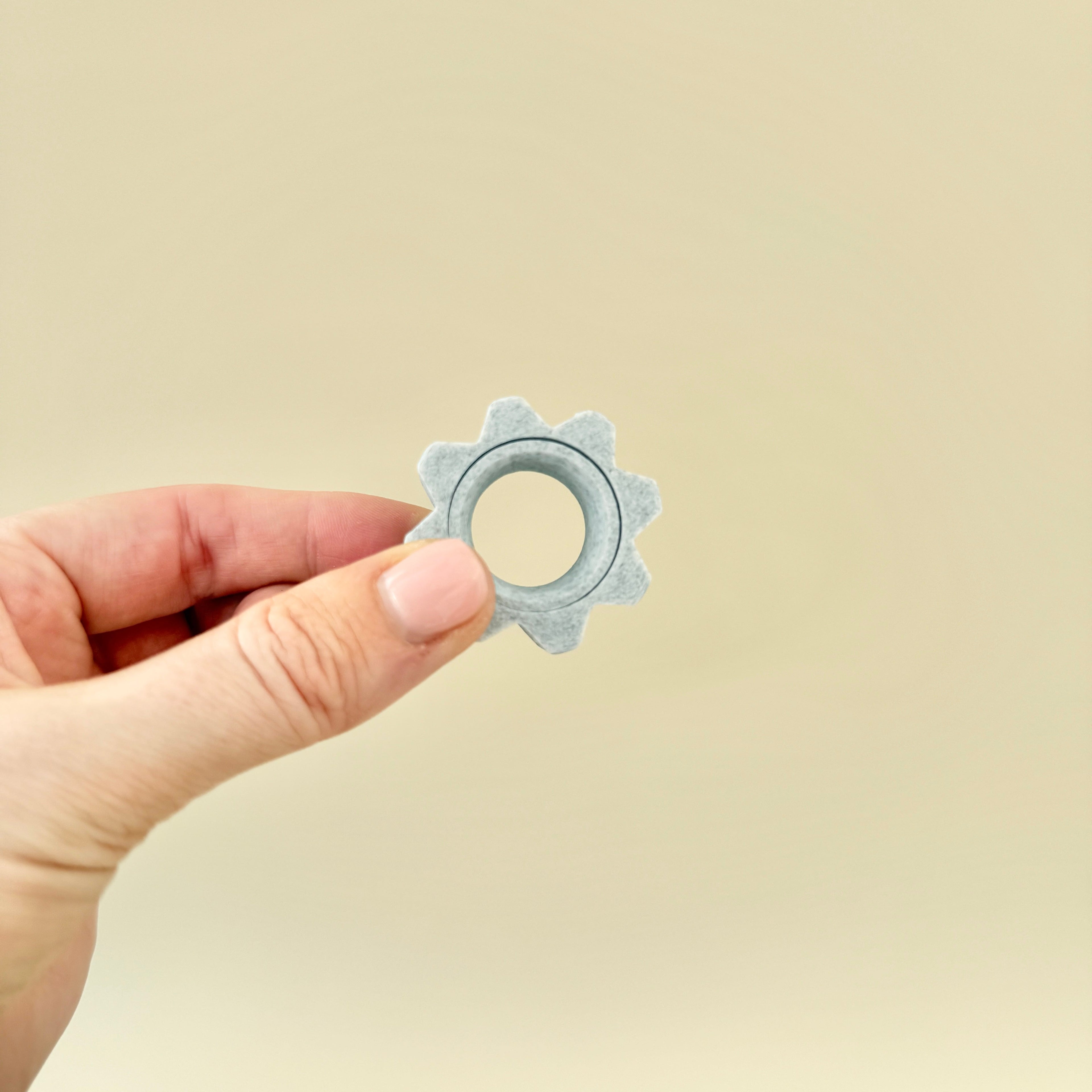 A pocket-sized, textured fidget ring for stress relief and sensory focus.