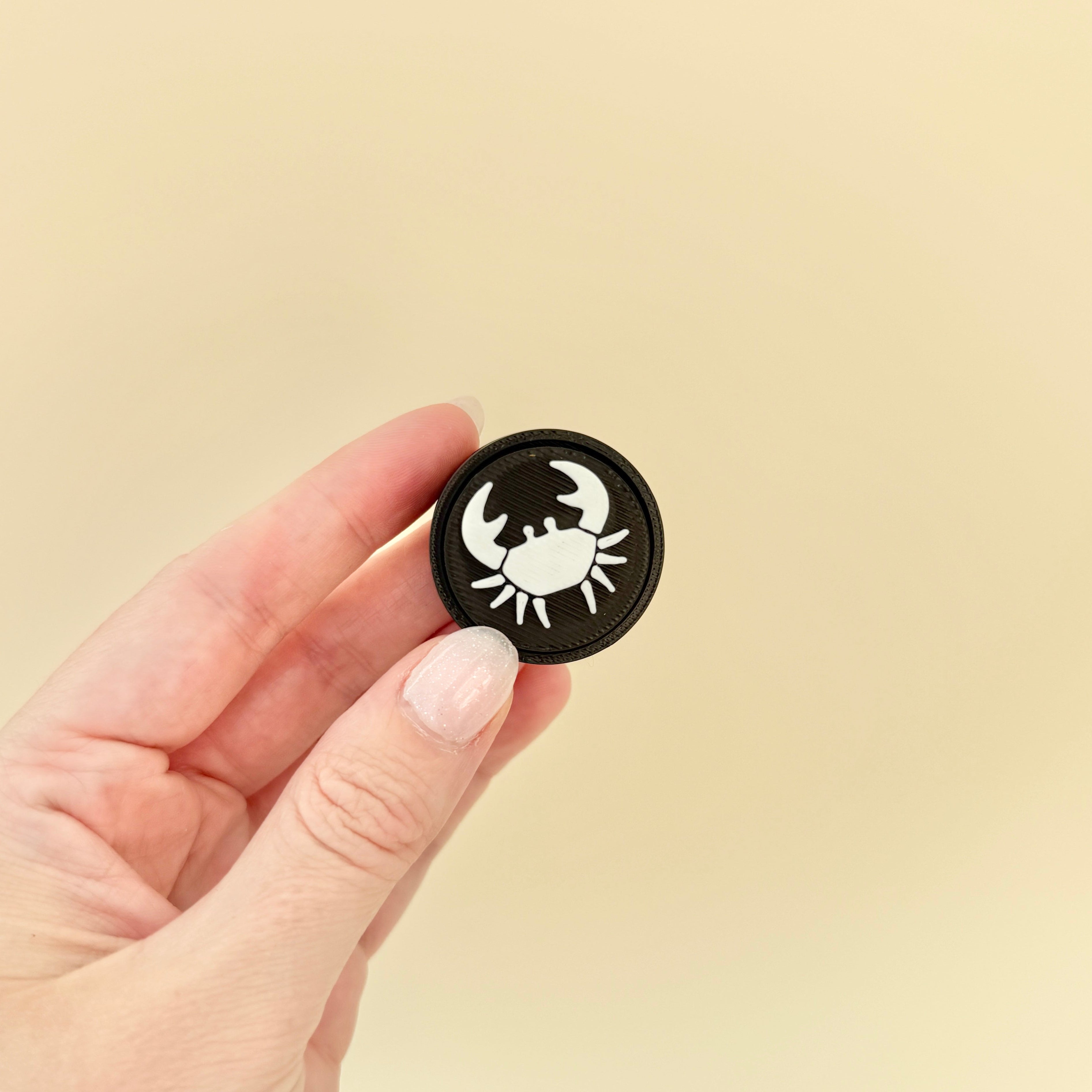 Compact fidget tool featuring zodiac signs, perfect for on-the-go sensory feedback and calming anxiety.