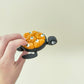 tactile fidget shell with seven pops, textured bubbles for stimming
