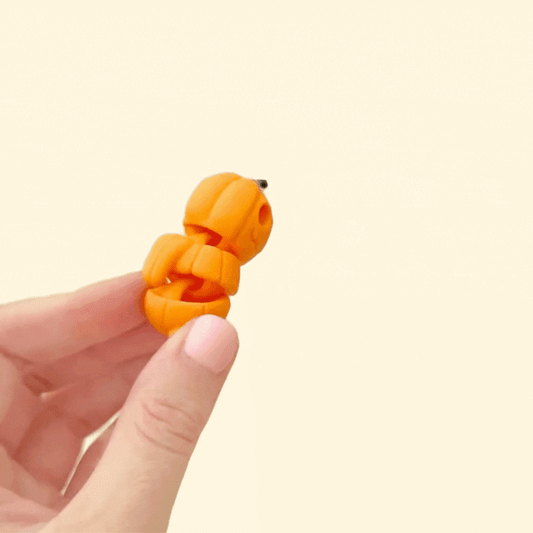 small articulated pumpkin fidget designed for sensory play
