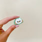 compact clicker button with raised details
