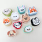collection of pocket-sized clickers arranged for product display