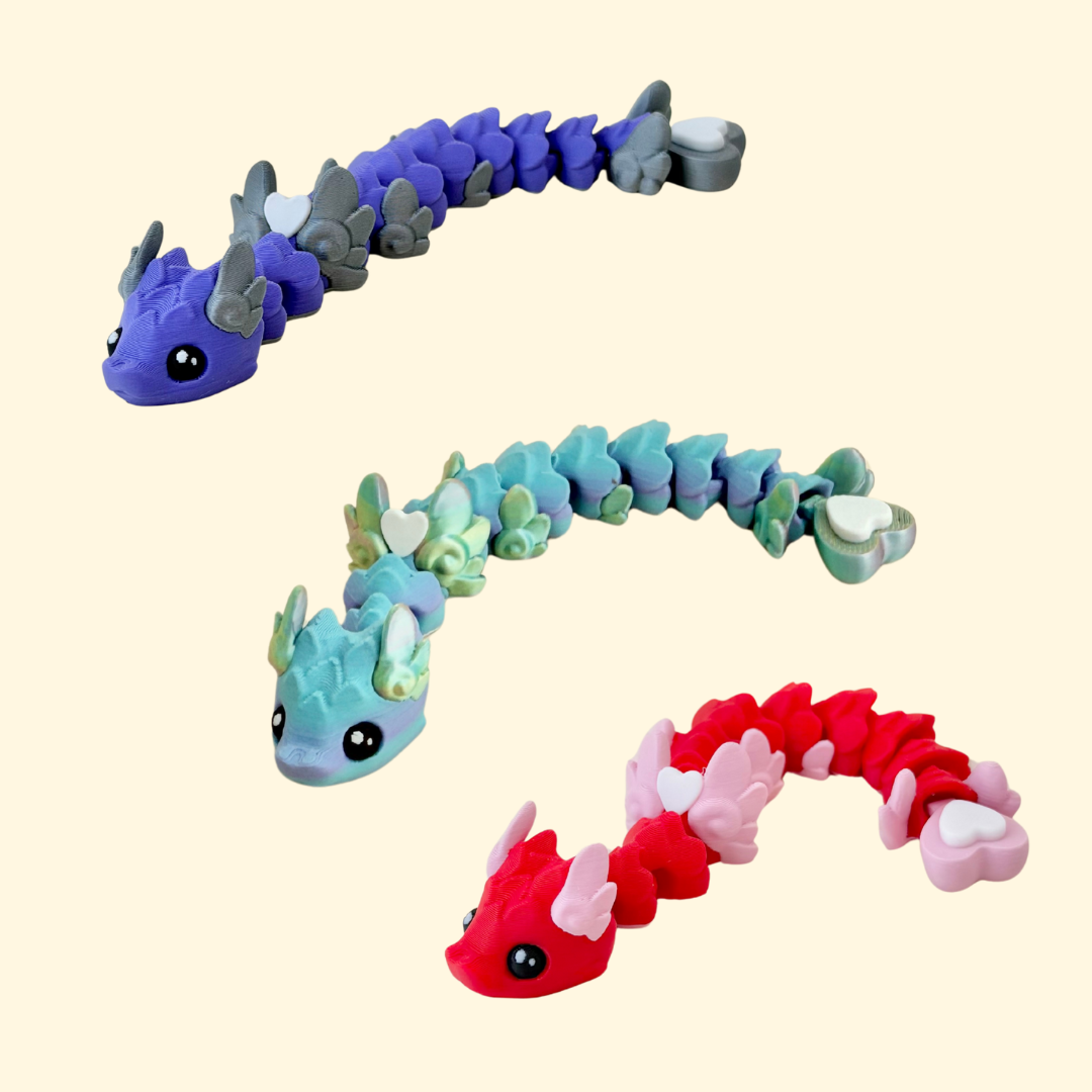 Articulated fidget snake in deep purple with silver accents and heart tip; satisfying movement for focus and regulation.
