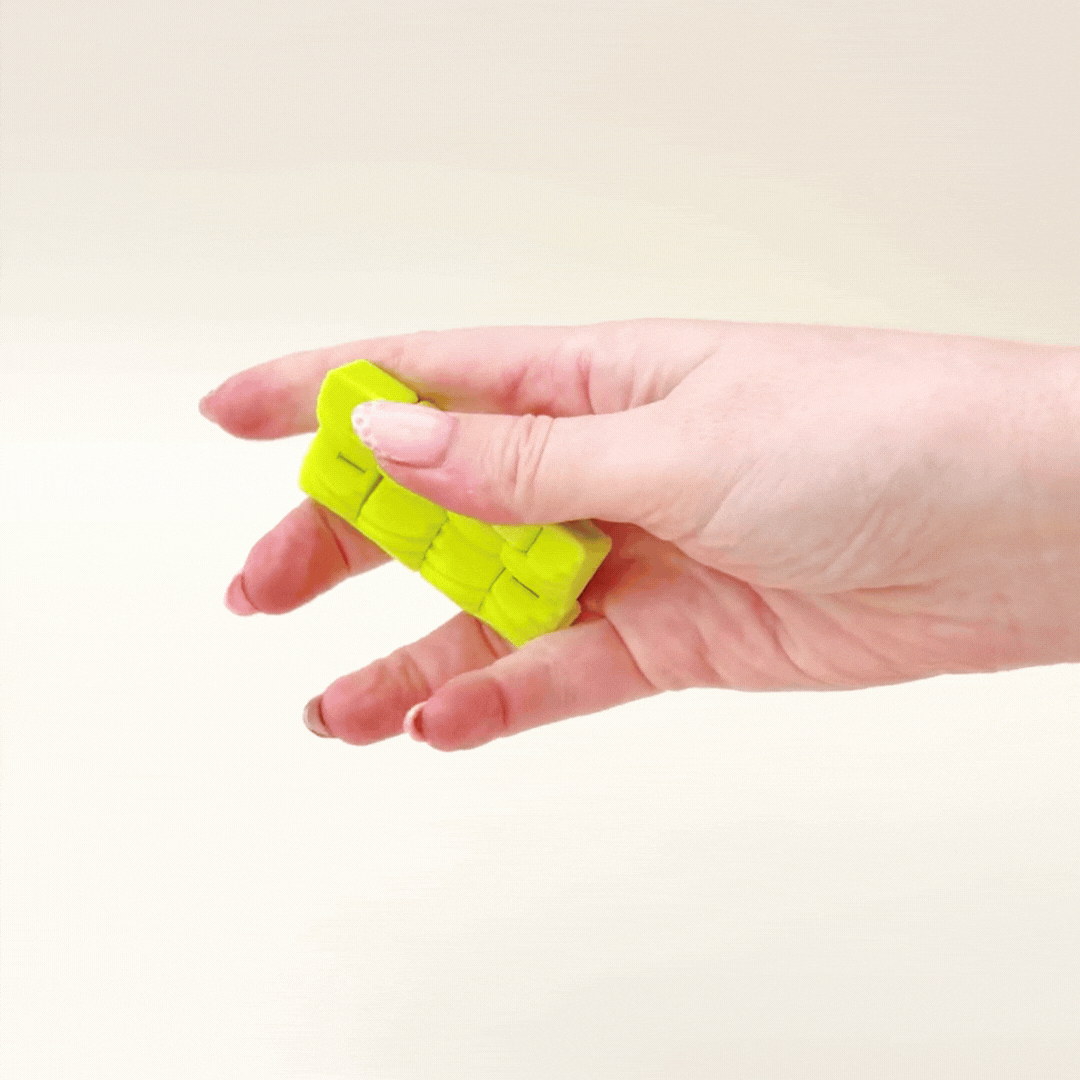 Discreet handheld fidget with smooth movement and gentle structure for calming sensory input without drawing attention
