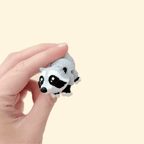 Realistic raccoon fidget toy with mottled grey, white, and black details, 10cm in length.