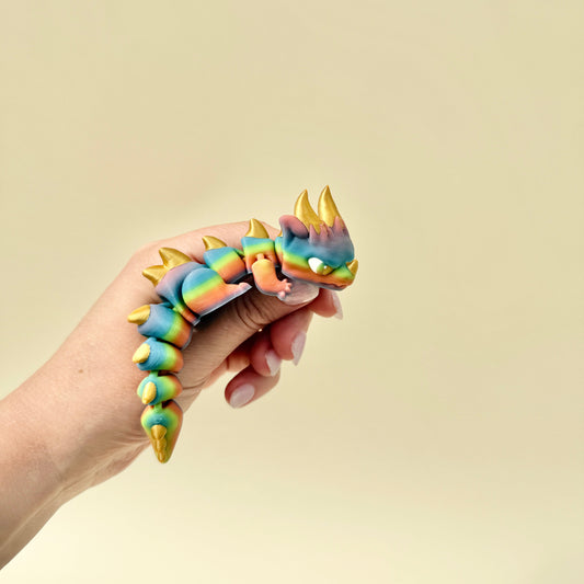 Colourful textured dragon toy with movable parts
