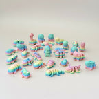 Small rainbow mini pet fidget toy with fully articulated body, designed for sensory play and stress relief.