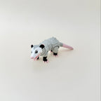 A detailed possum fidget toy with a lifelike textured fur design, suitable for fidgeting, play, and collecting.