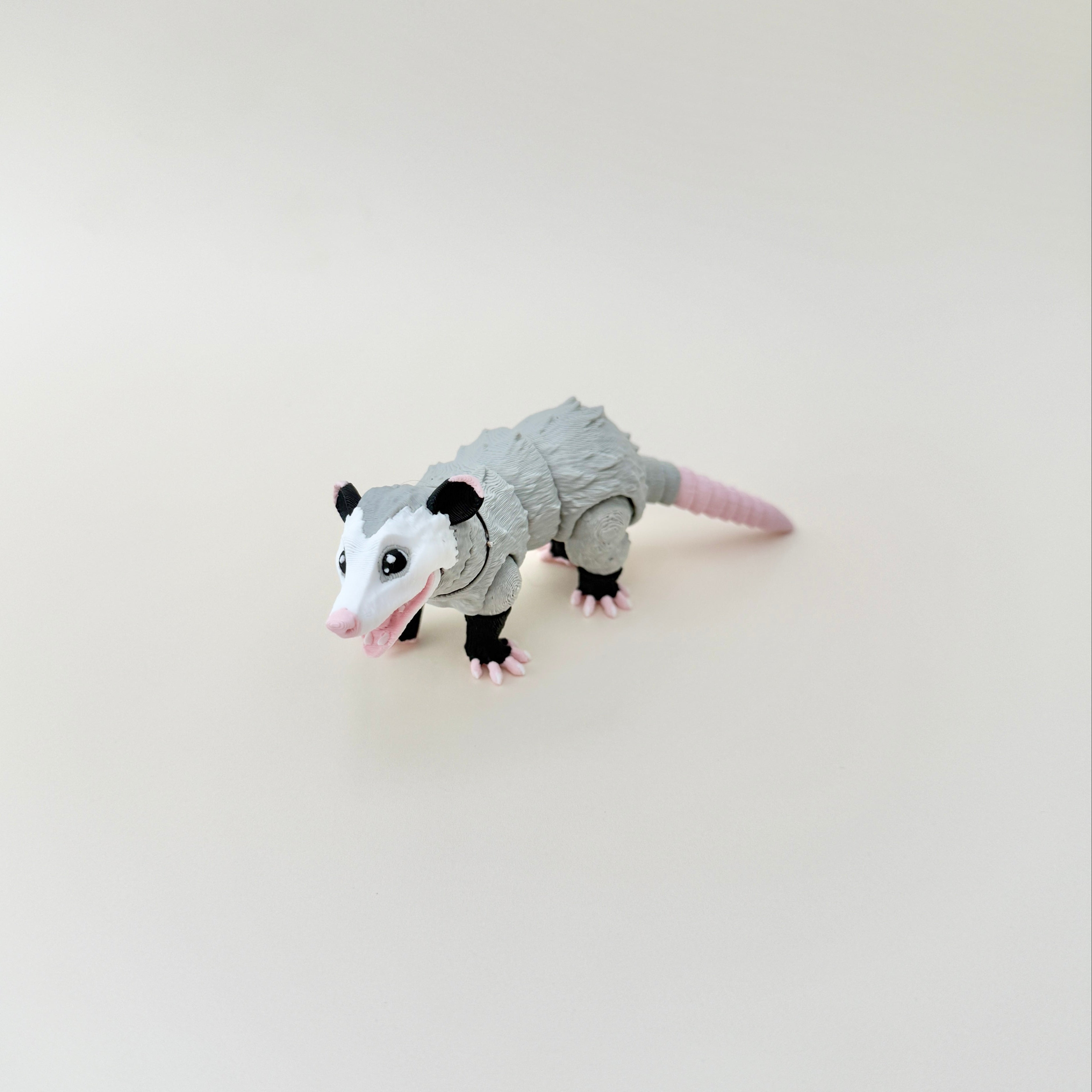A detailed possum fidget toy with a lifelike textured fur design, suitable for fidgeting, play, and collecting.