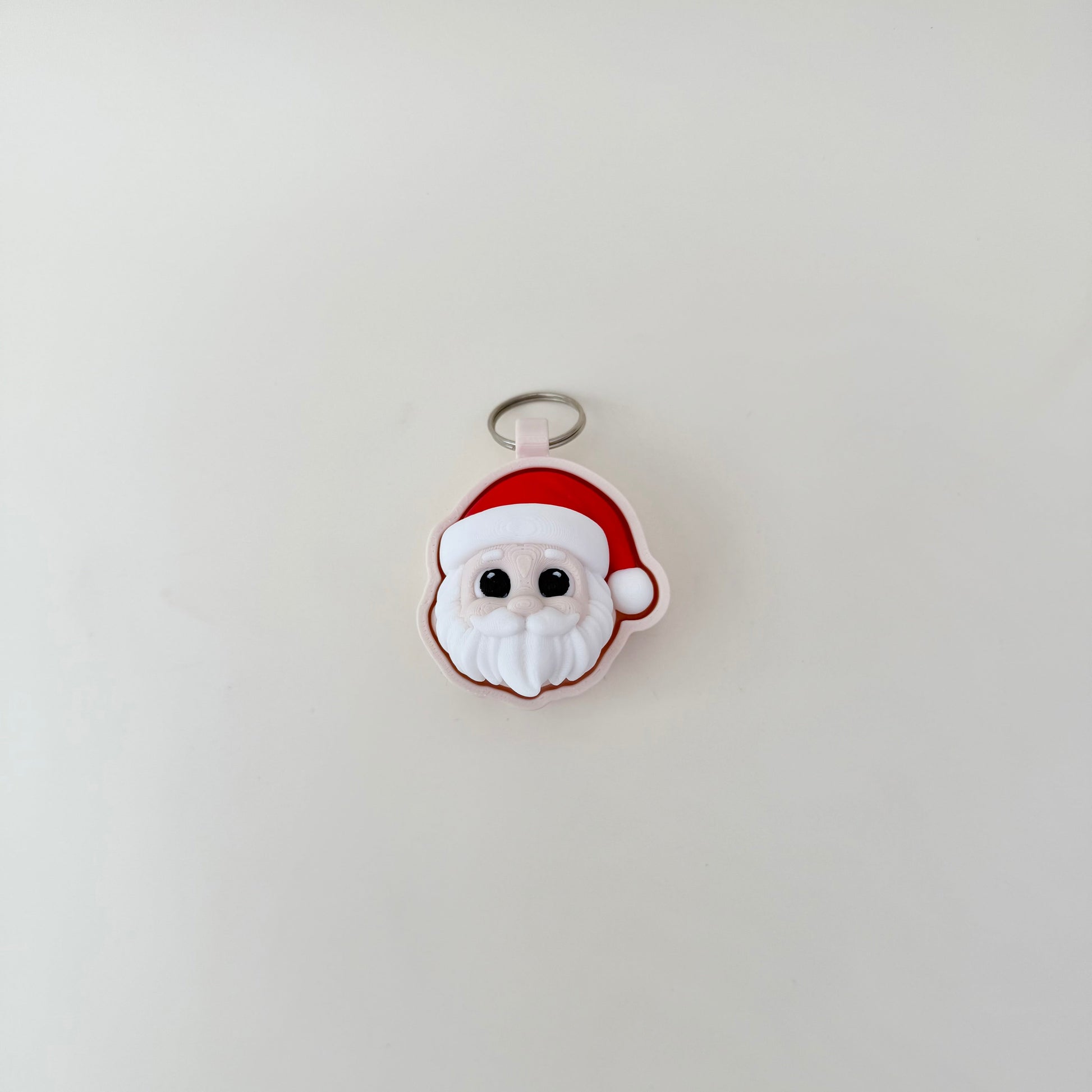 Christmas Santa sensory click tool, 6 cm, tactile hat and beard, desk-friendly with optional quiet click.
