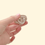 Close-up of the RidgeSpin fidget spinner, showcasing its textured grip and independently spinning rings.