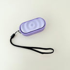 Ripple Click fidget toy with three clicker zones and textured design in lilac and purple.