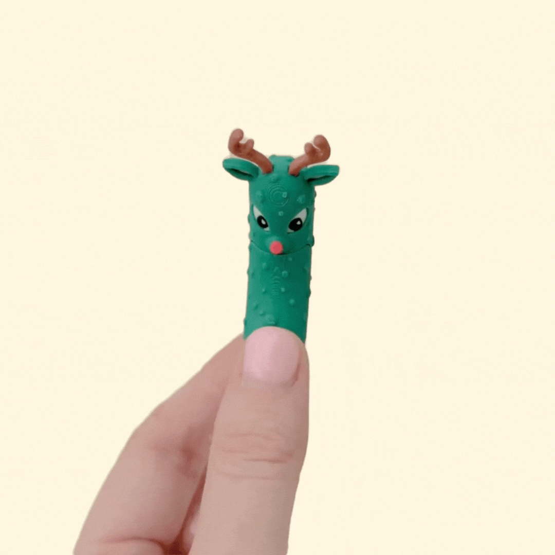 A festive pickle-themed fidget with a moving mouth and textured surface for quiet sensory play.
