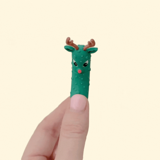 A festive pickle-themed fidget with a moving mouth and textured surface for quiet sensory play.
