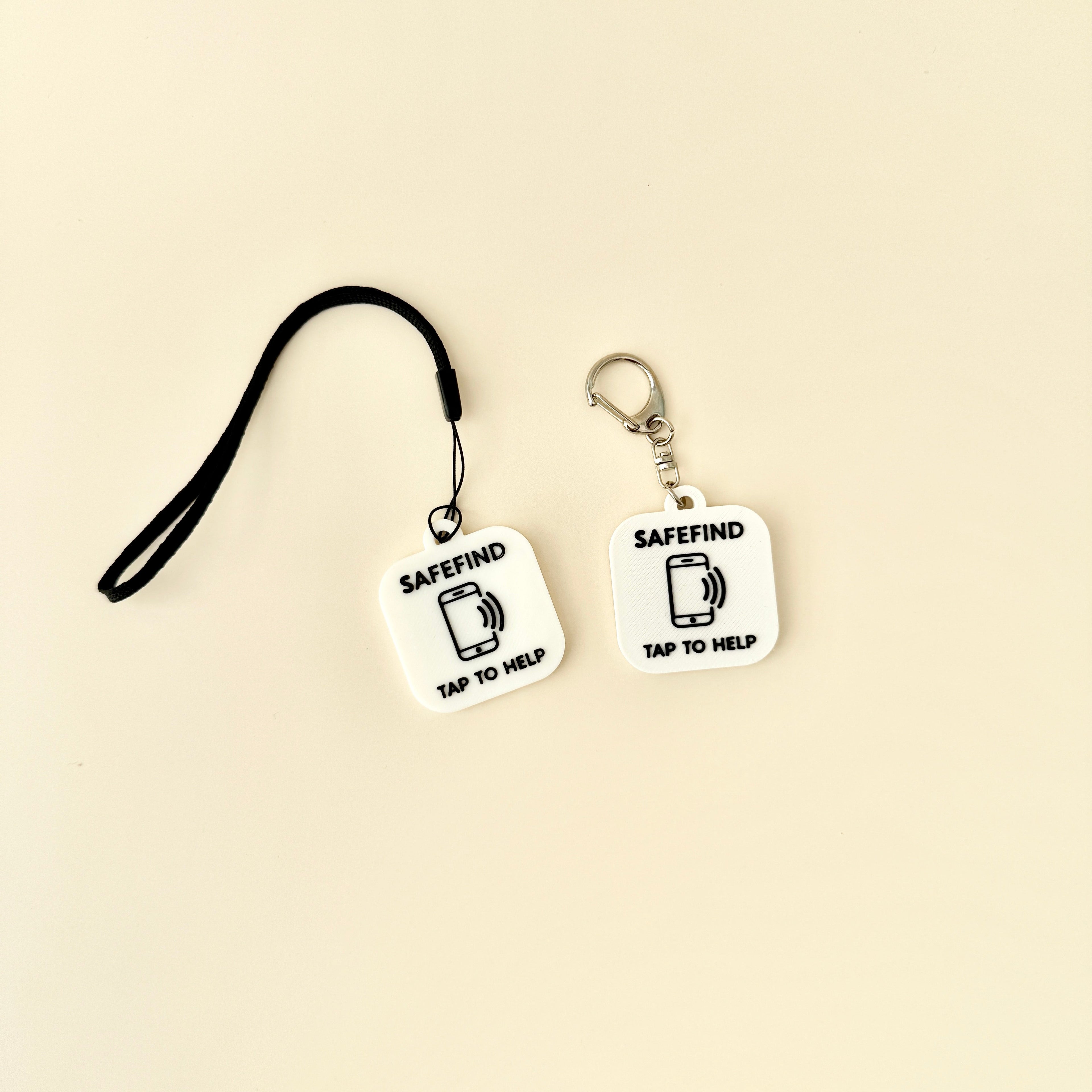 A compact and stylish SafeTag keyring designed for NFC functionality, available in sleek black or white.