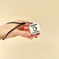 A durable and functional keyring with NFC technology for programming contact details or locations.