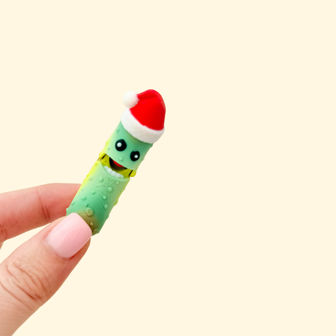 Mini festive character with a red hat and a press-to-chomp action.

