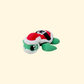Small 5 cm festive turtle fidget in green and red for Christmas displays and quiet desk fidgeting.
