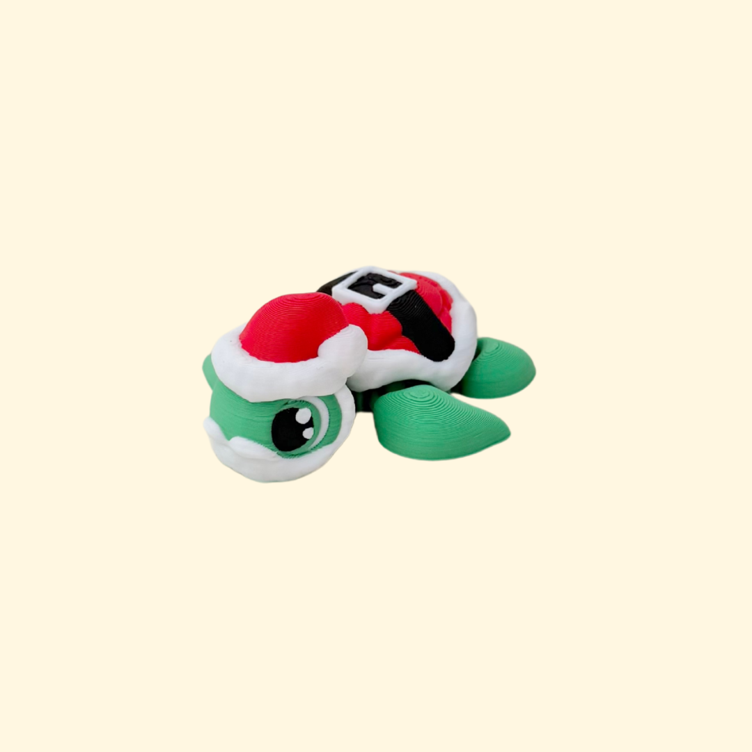 Small 5 cm festive turtle fidget in green and red for Christmas displays and quiet desk fidgeting.
