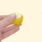 Dual-tone yellow clicker ideal for classroom prizes and sensory use.