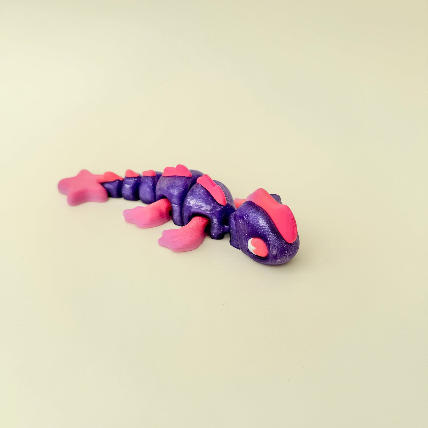 A flexible sensory sea creature fidget designed for calming play and stim support.
