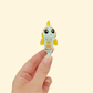 Flexible light blue seahorse fidget with yellow glitter detailing, ideal for tactile play.