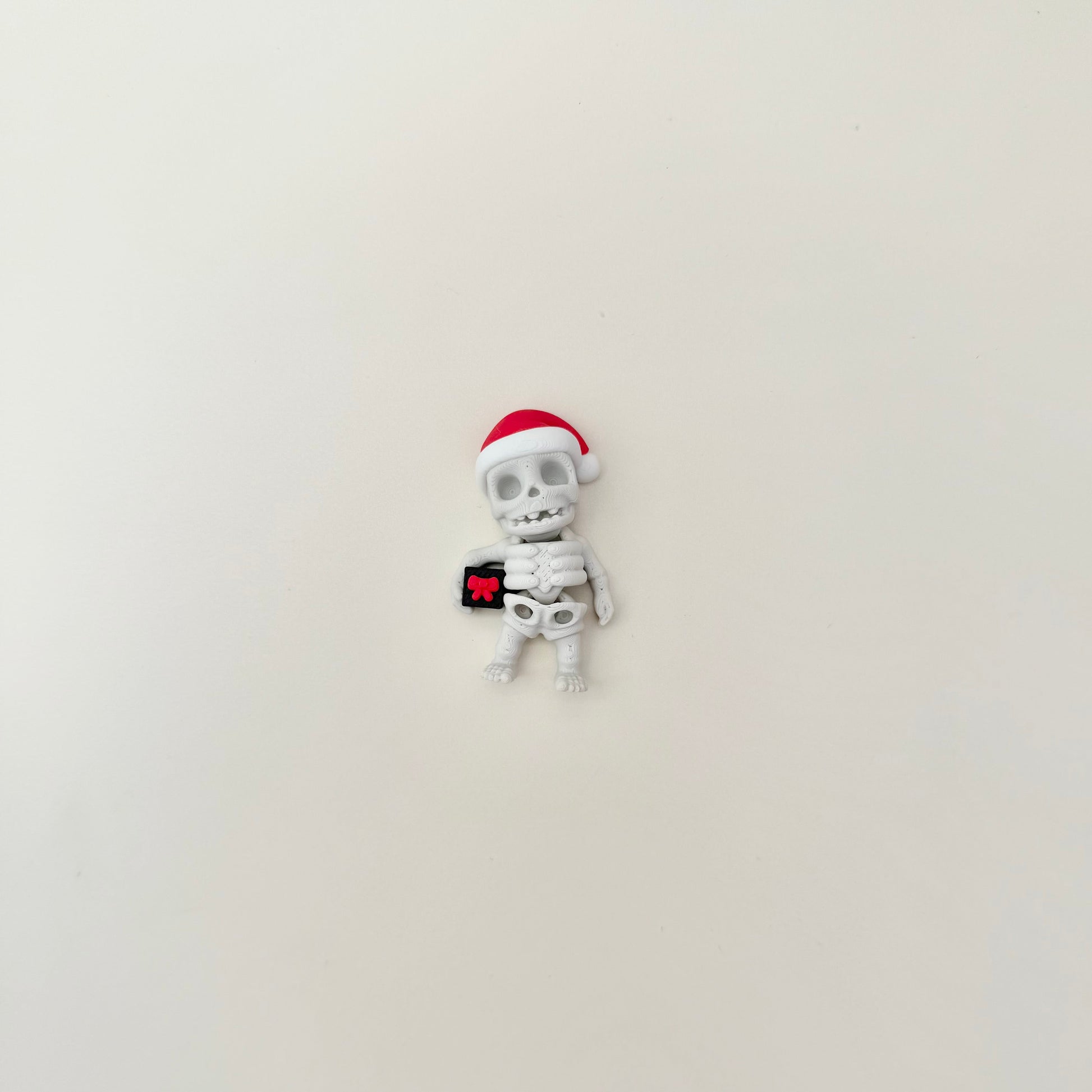 Mini articulated character for sensory seekers and toy collectors.