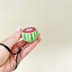 4 cm watermelon clicker toy designed for tactile input and stress relief
