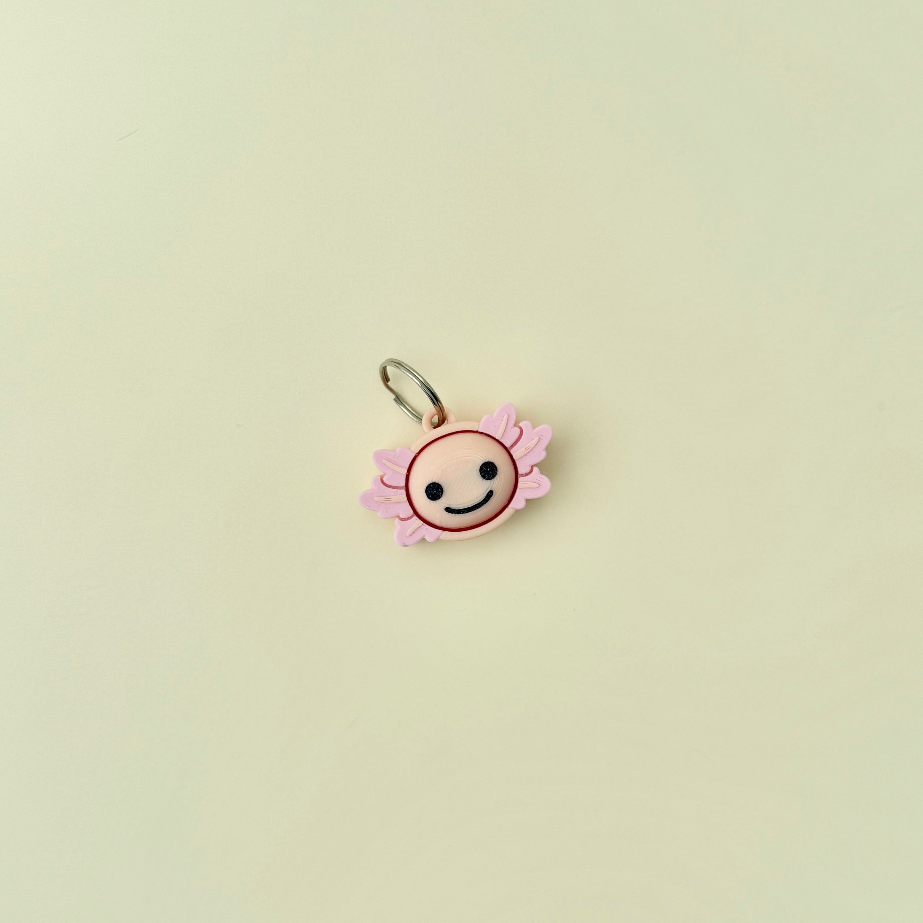 Tactile fidget tool with soft edges and pressable centre.