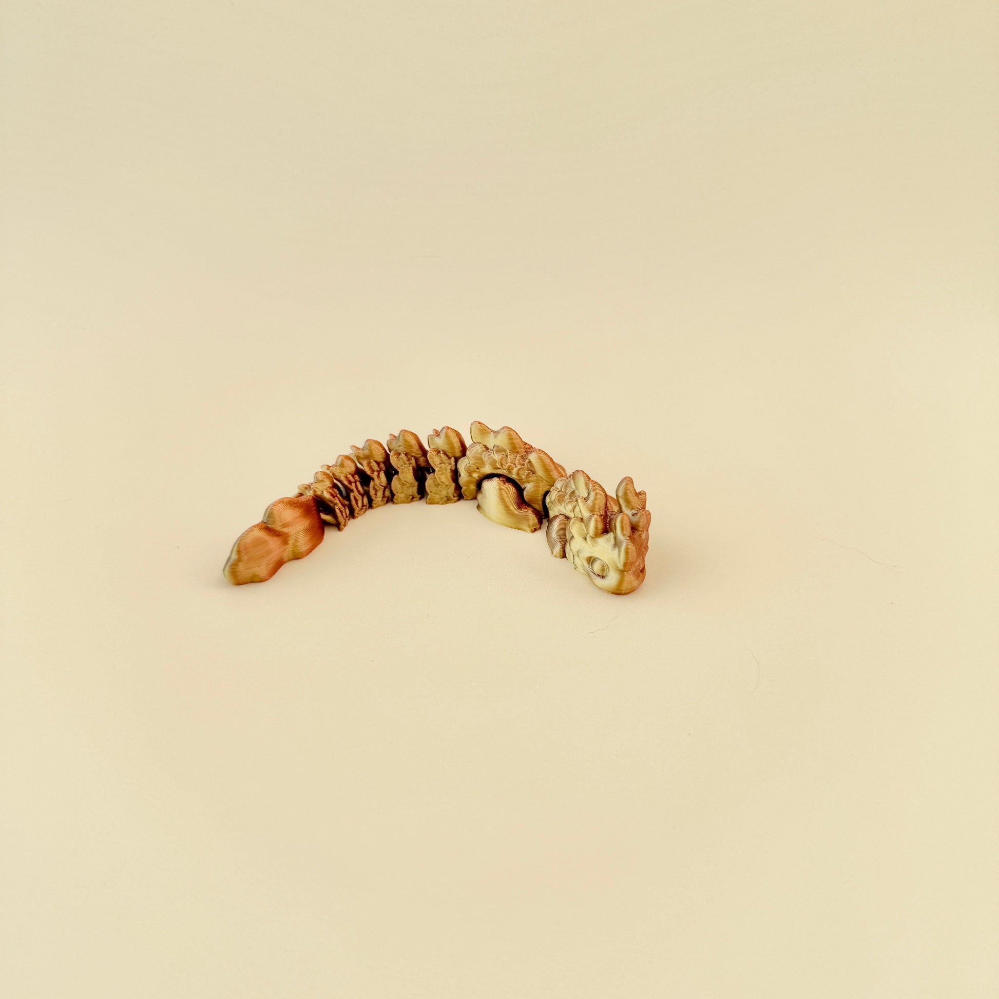 A moveable mini dragon fidget, ideal for collectors and sensory seekers.