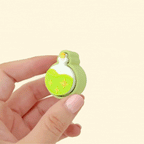 Tactile clicker toy with raised golden stars and a shimmering potion design