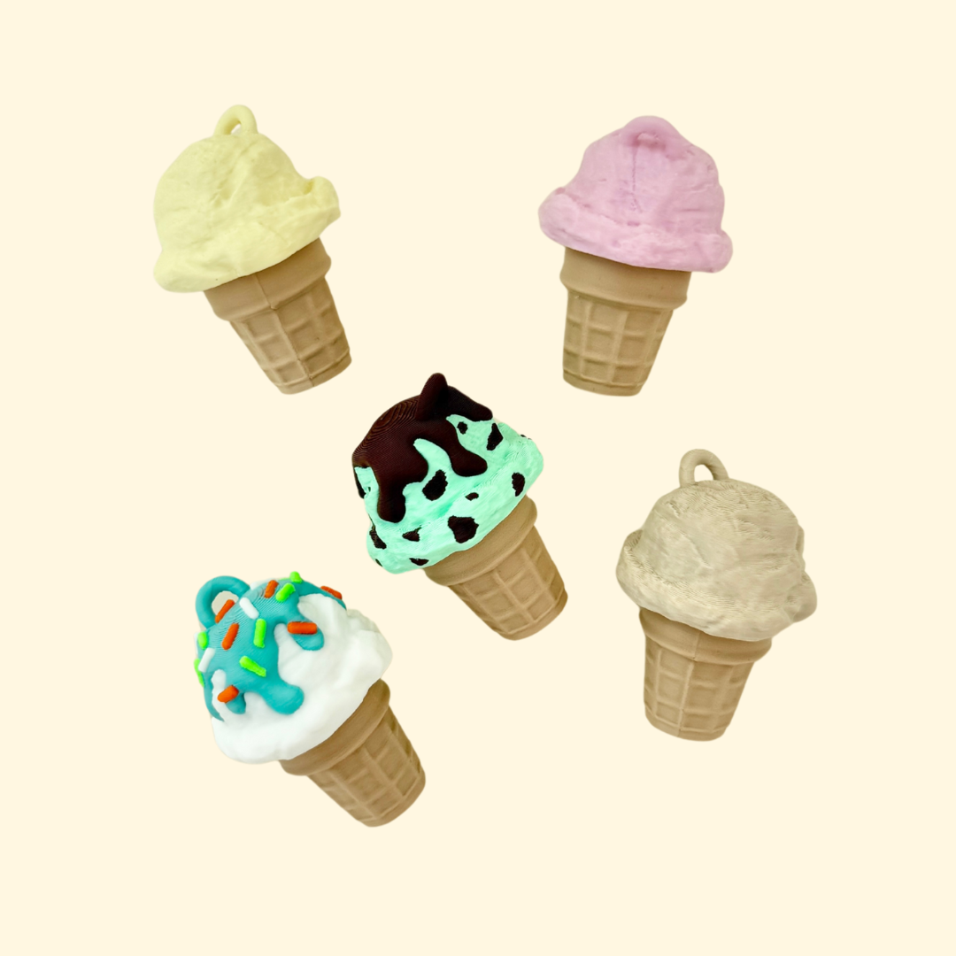 Textured fidget toy shaped like an ice cream with a keyring attachment and tactile details.