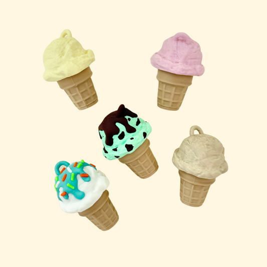 Textured fidget toy shaped like an ice cream with a keyring attachment and tactile details.