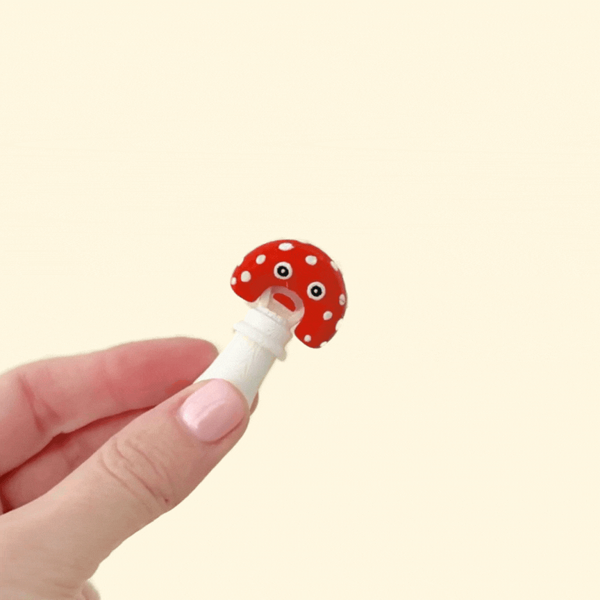 A small, interactive fidget toy with a moving top.