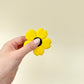 Flower-shaped spinner with textured petals and a quiet spin for fidgeting
