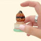 Pressable mushroom cap fidget for satisfying single clicks.
