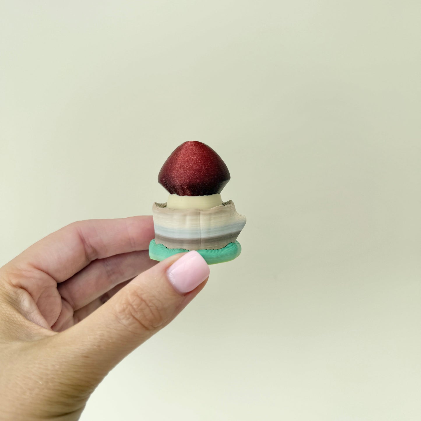 Textured mushroom clicker for sensory stimming and focus.
