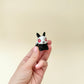 small bunny with bone-style details and basket handle for portable grounding
