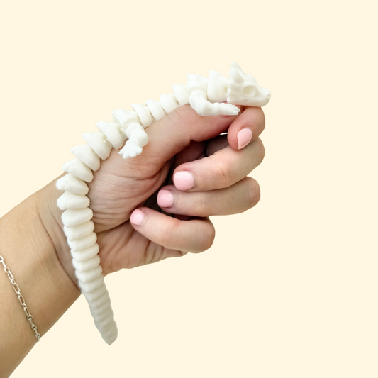 articulated dragon fidget toy with bone-inspired detailing
