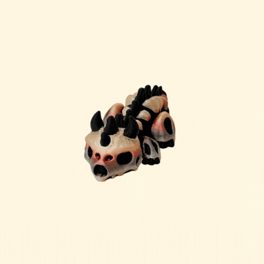 small articulated bone-style dragon fidget with textured details for sensory play
