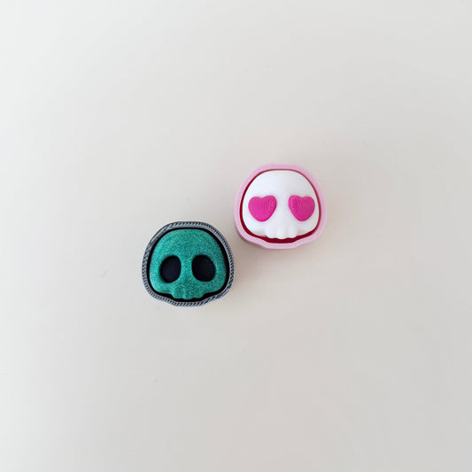 small skull-shaped clicker fidget with textured surface for sensory play
