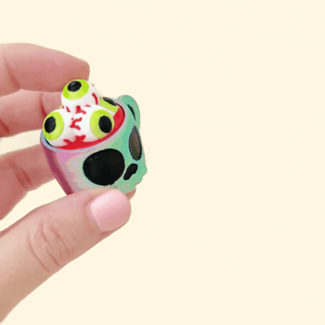 halloween-themed cup fidget toy with clickable eyeball top for stimming
