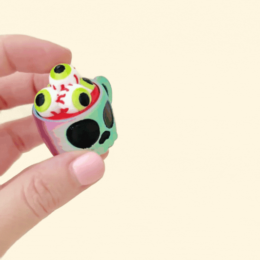 halloween-themed cup fidget toy with clickable eyeball top for stimming
