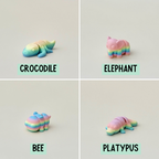 Tiny rainbow animal fidget, designed for sensory relaxation and collecting, with a flexible, articulated body.